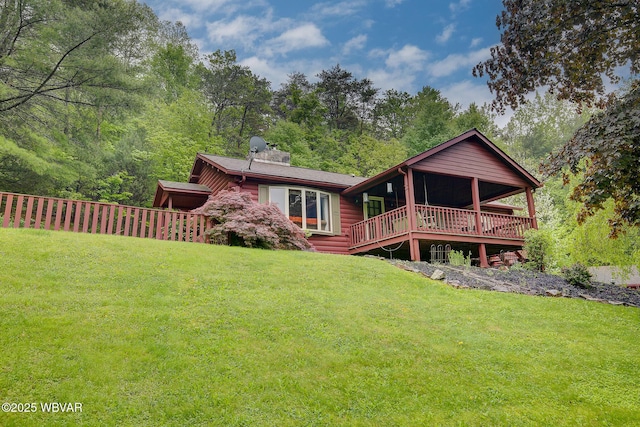 1640 Pleasant Valley Rd, Cogan Station, PA 17728 - rear view of house featuring a lawn and a wooden deck