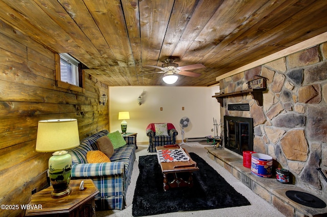 1640 Pleasant Valley Rd, Cogan Station, PA 17728 - living room with carpet floors, wood ceiling, wood walls, a ceiling fan, and a fireplace