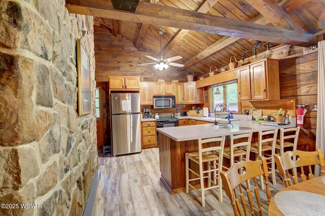 1640 Pleasant Valley Rd, Cogan Station, PA 17728 - kitchen with appliances with stainless steel finishes, wooden ceiling with exposed beams, a peninsula, light wood-type flooring, and light countertops