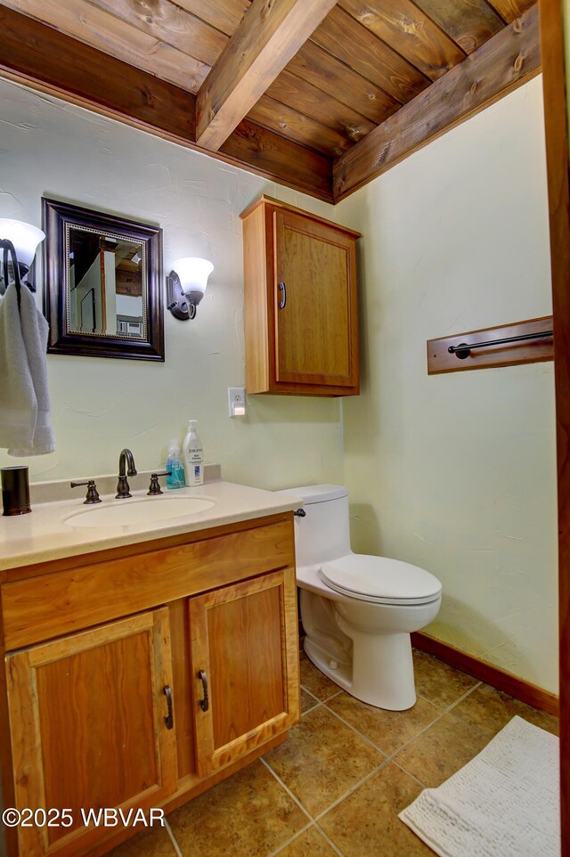 1640 Pleasant Valley Rd, Cogan Station, PA 17728 - bathroom with wood ceiling with exposed beams, vanity, toilet, tile patterned floors, and baseboards