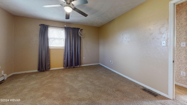 carpeted empty room featuring ceiling fan