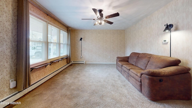 carpeted living room with baseboard heating and ceiling fan