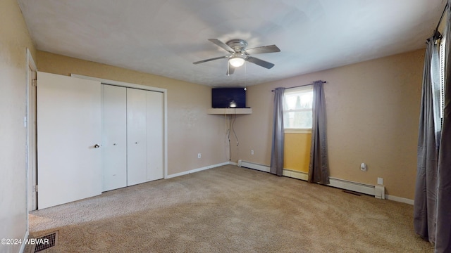 unfurnished bedroom featuring a closet, light colored carpet, and ceiling fan