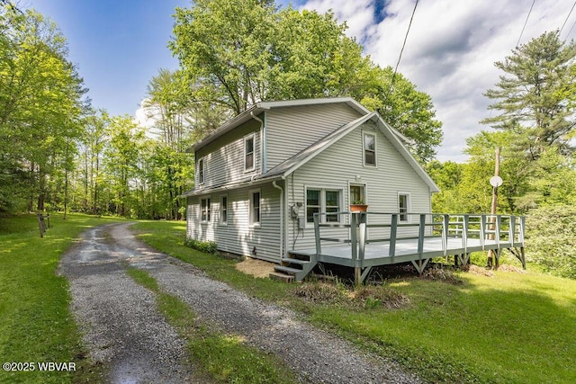 1462 Highland Lake Rd, Hughesville, PA 17737 - view of front of home featuring a wooden deck and a front lawn