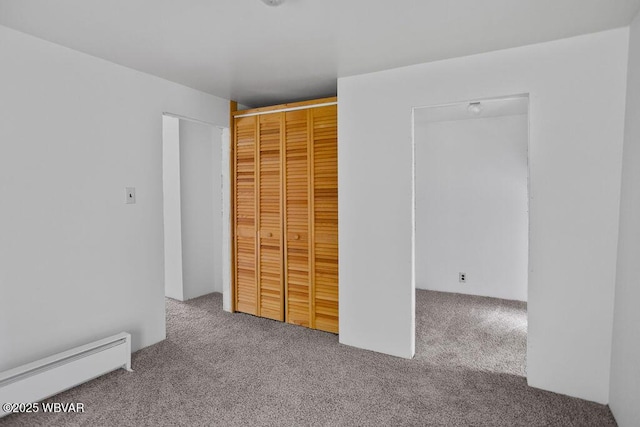 1462 Highland Lake Rd, Hughesville, PA 17737 - unfurnished bedroom with a baseboard heating unit, carpet flooring, and a closet