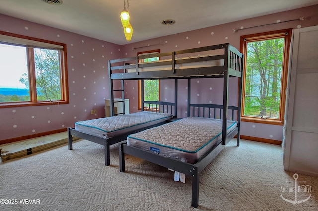 2312 Teaberry Ln, Lock Haven, PA 17745 - carpeted bedroom featuring multiple windows, visible vents, and baseboards