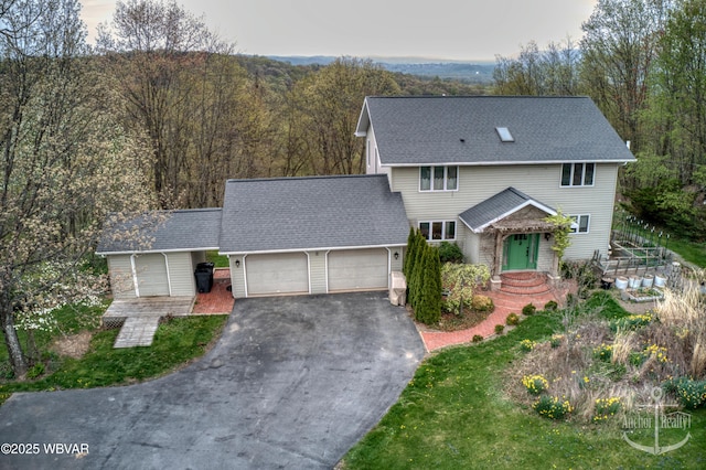 2312 Teaberry Ln, Lock Haven, PA 17745 - view of front of home with a wooded view, a shingled roof, driveway, and an attached garage