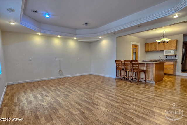 2312 Teaberry Ln, Lock Haven, PA 17745 - living area featuring a raised ceiling, light wood-type flooring, and baseboards