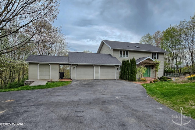 2312 Teaberry Ln, Lock Haven, PA 17745 - traditional-style home featuring driveway, a front yard, and a garage