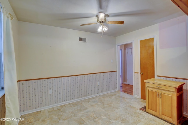 spare room featuring ceiling fan