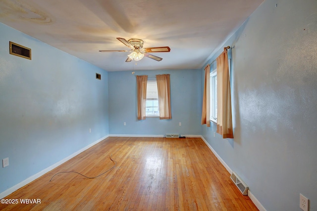 spare room with ceiling fan and light hardwood / wood-style floors