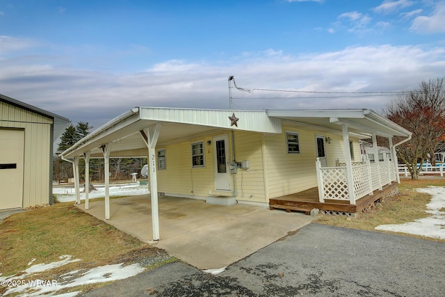 view of front of home with a carport