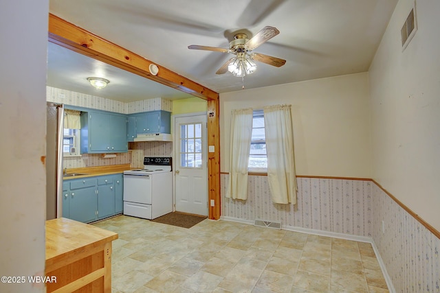 kitchen with butcher block countertops, white electric stove, sink, and blue cabinets