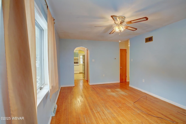 spare room with ceiling fan and light hardwood / wood-style floors