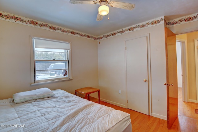 bedroom featuring ceiling fan and light wood-type flooring