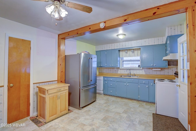 kitchen with blue cabinetry, sink, butcher block countertops, ceiling fan, and white appliances