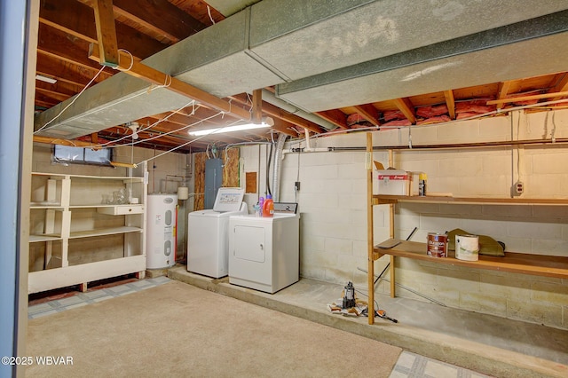 basement with independent washer and dryer, electric panel, and electric water heater