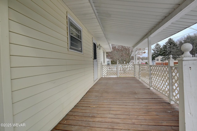 wooden terrace featuring covered porch