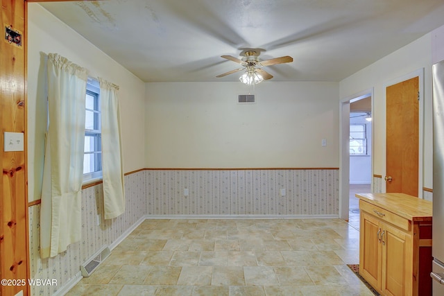 spare room with ceiling fan