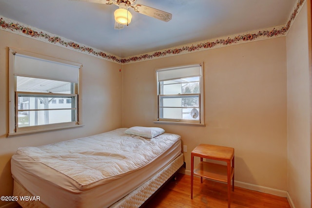 bedroom featuring wood-type flooring and ceiling fan