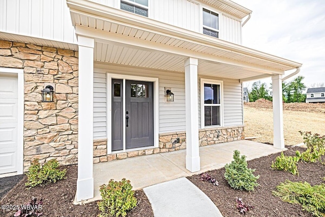 doorway to property with covered porch