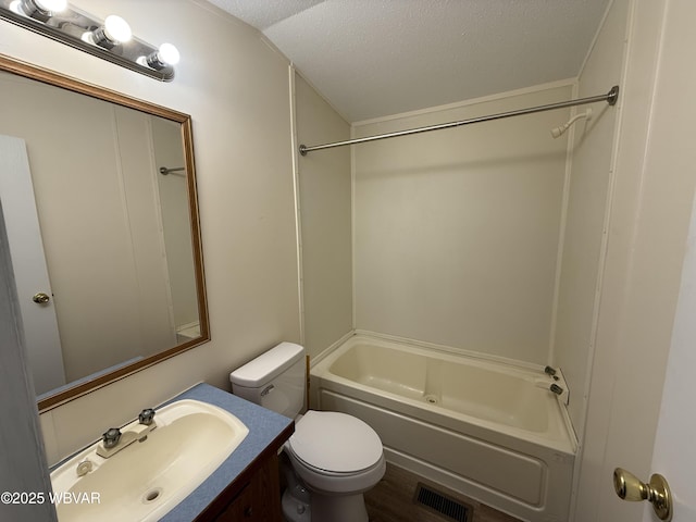 full bathroom with vanity, shower / bathing tub combination, a textured ceiling, and toilet