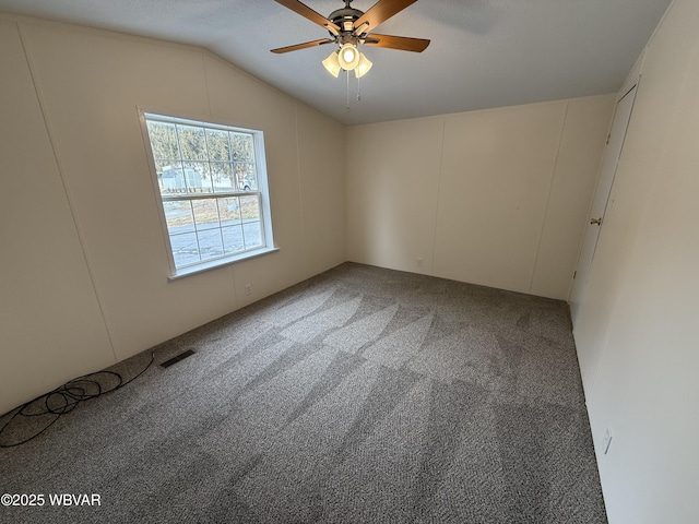 unfurnished room featuring carpet, ceiling fan, and lofted ceiling