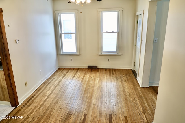 spare room featuring light hardwood / wood-style flooring and ceiling fan