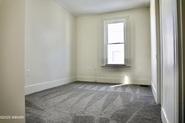 empty room featuring carpet flooring