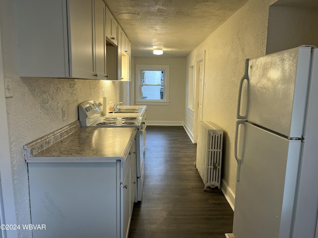 kitchen featuring dark hardwood / wood-style flooring, radiator, white appliances, a textured ceiling, and sink