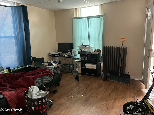 bedroom featuring hardwood / wood-style floors and radiator