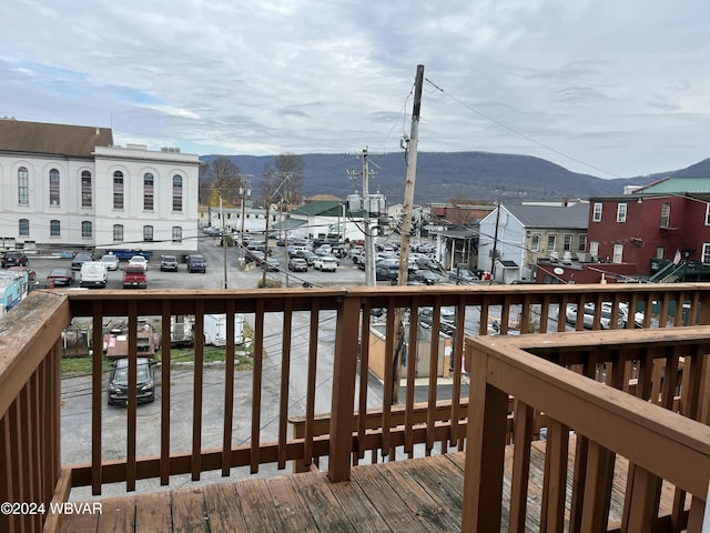 wooden deck featuring a mountain view