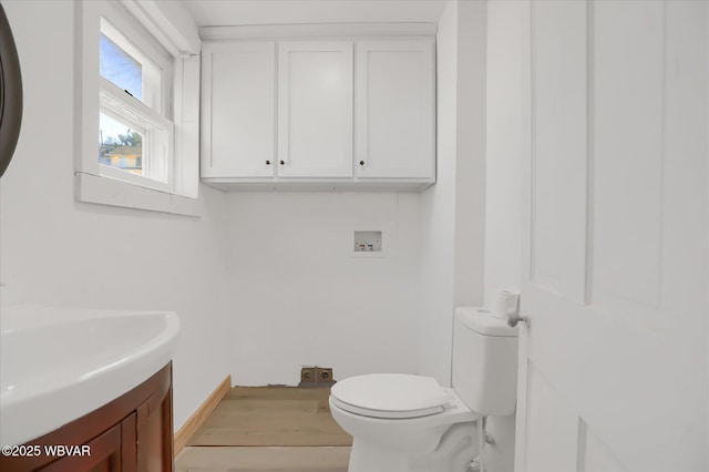 half bath with toilet and vanity