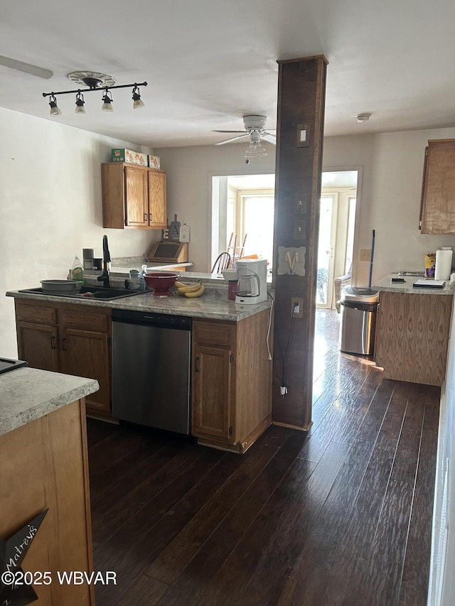 kitchen with dark hardwood / wood-style flooring, sink, dishwasher, and ceiling fan