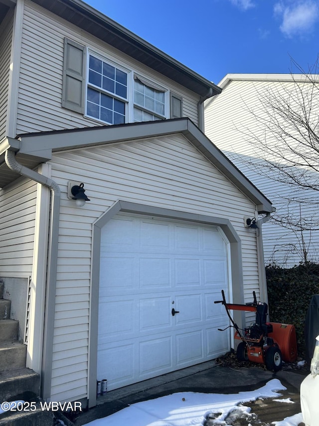 view of snow covered garage