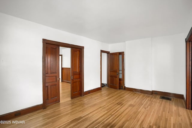 unfurnished bedroom featuring light wood-type flooring