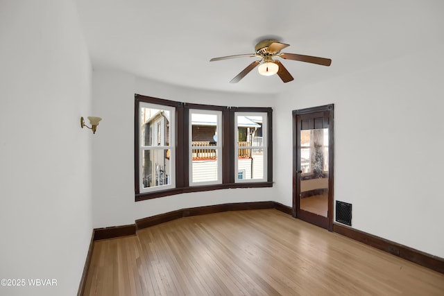 spare room with ceiling fan and light hardwood / wood-style flooring