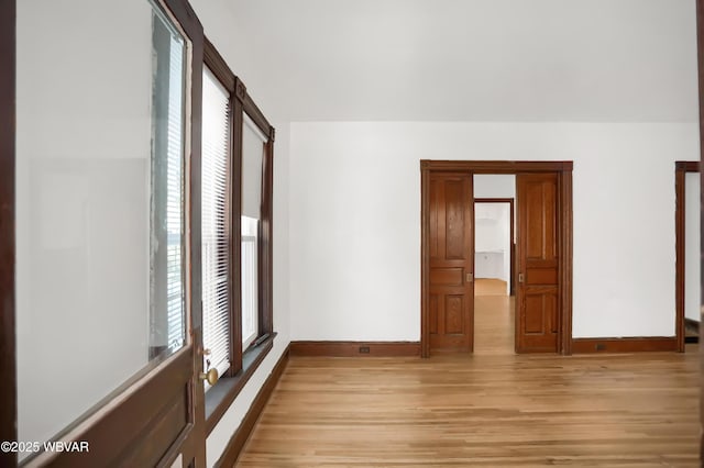 spare room featuring light hardwood / wood-style floors