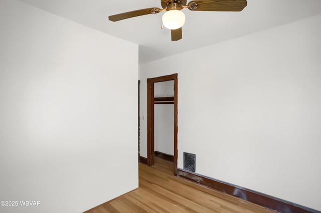 unfurnished room with light hardwood / wood-style floors and ceiling fan