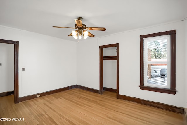 empty room featuring ceiling fan and light wood-type flooring