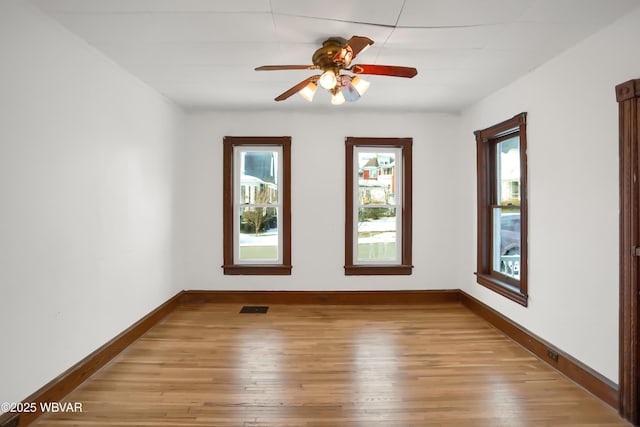 spare room featuring ceiling fan and wood-type flooring