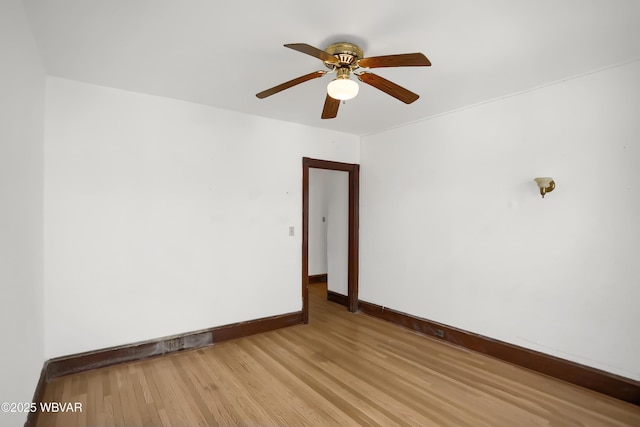 spare room featuring ceiling fan and light wood-type flooring