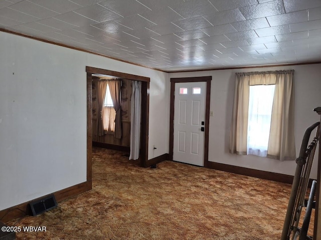 1358 W Valley Rd, Loganton, PA 17747 - entryway featuring carpet flooring, visible vents, baseboards, and ornamental molding