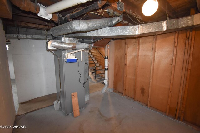 unfinished below grade area featuring heating unit