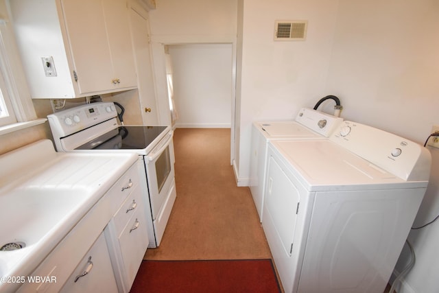 interior space with laundry area, carpet, visible vents, and separate washer and dryer