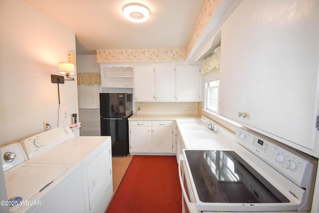 kitchen with white cabinets, light countertops, freestanding refrigerator, range, and washer and clothes dryer