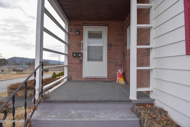 property entrance featuring covered porch