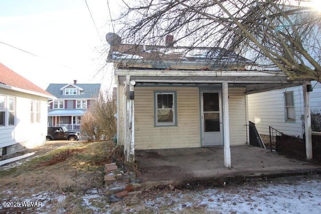 back of property with a patio area