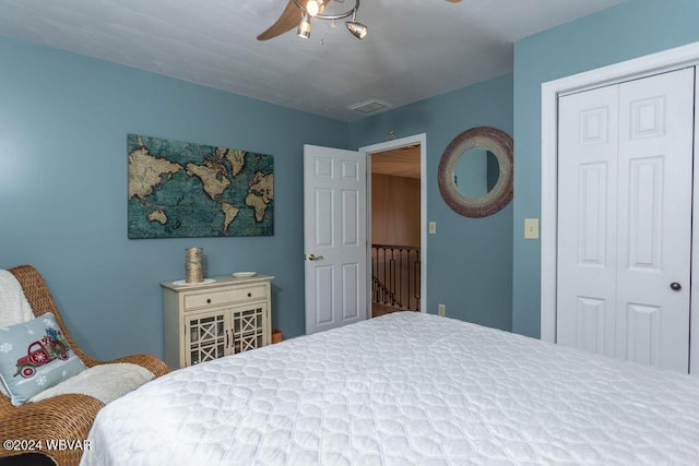 bedroom with ceiling fan and a closet