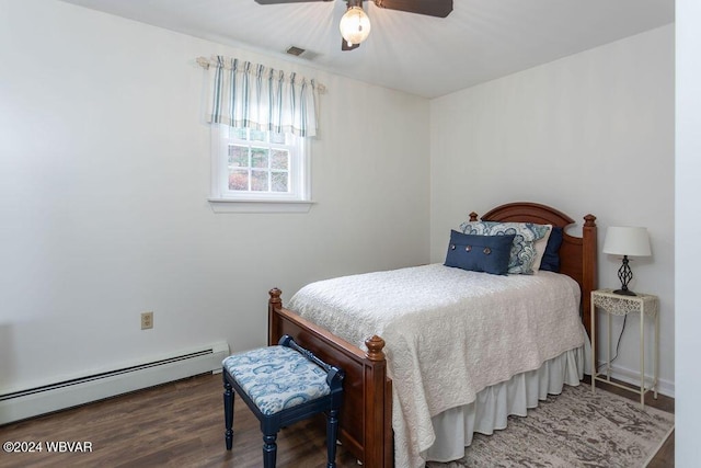 bedroom featuring baseboard heating, ceiling fan, and hardwood / wood-style flooring